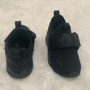 Black Puma athletic shoes size 11C.